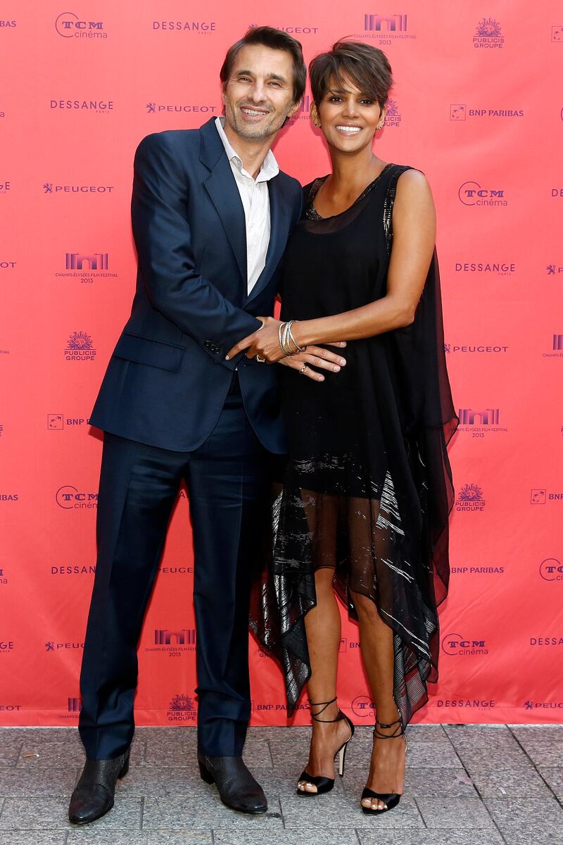 epa03787737 (FILE) A file picture dated 13 June 2013 shows French actor Olivier Martinez (L) and US actress Halle Berry (R) posing duing a photocall as part as the Champs Elysees Film Festival in Paris, France. According to media reports the couple married on 13 July 2013 during an intimate ceremony at Chateau des Conde in Vallery, France.  EPA/YOAN VALAT