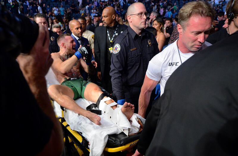 Conor McGregor is carried off a stretcher following an injury suffered against Dustin Poirier during UFC 264 at T-Mobile Arena on Jul 10, 2021 in Las Vegas,