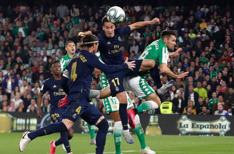 Real Madrid midfielder Lucas Vazquez wins a header against Real Betis. AP Photo