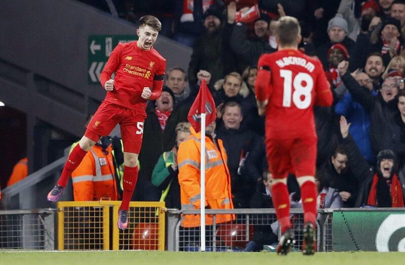 Liverpool’s Ben Woodburn celebrates scoring their second goal. Carl Recine / Action Images / Reuters