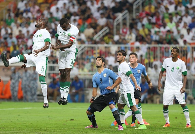 Uruguay's Luis Suarez, third left. vies for the ball with Mustafa Al Bassas, fourth right, during an international friendly against Saudi Arabia on Friday in Jeddah. EPA Photo / October 10, 2014