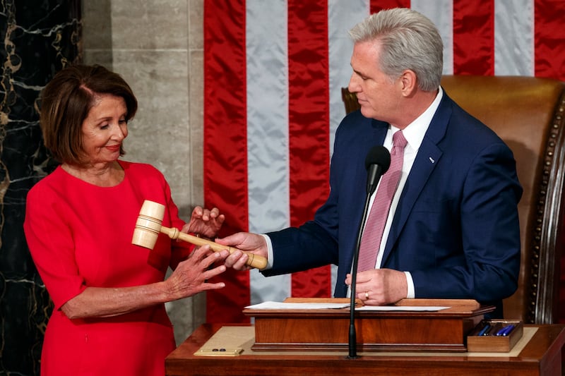 Ms Pelosi takes the gavel from House Minority Leader Kevin McCarthy in 2019. AP