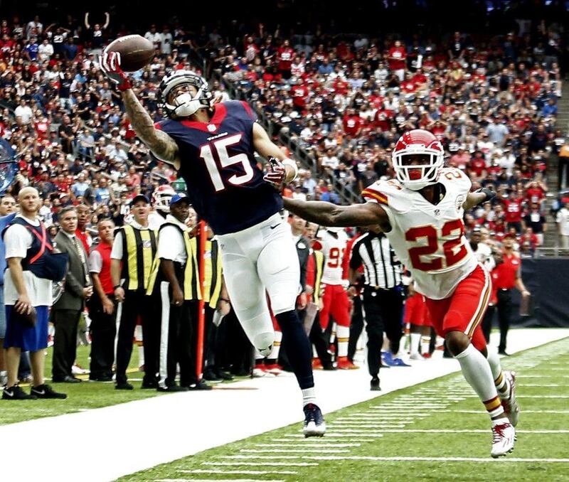 Houston Texans 19 Kansas City Chiefs 12: Texans receiver Will Fuller reaches for the ball against Chiefs player Marcus Peters. Larry W Smith / EPA