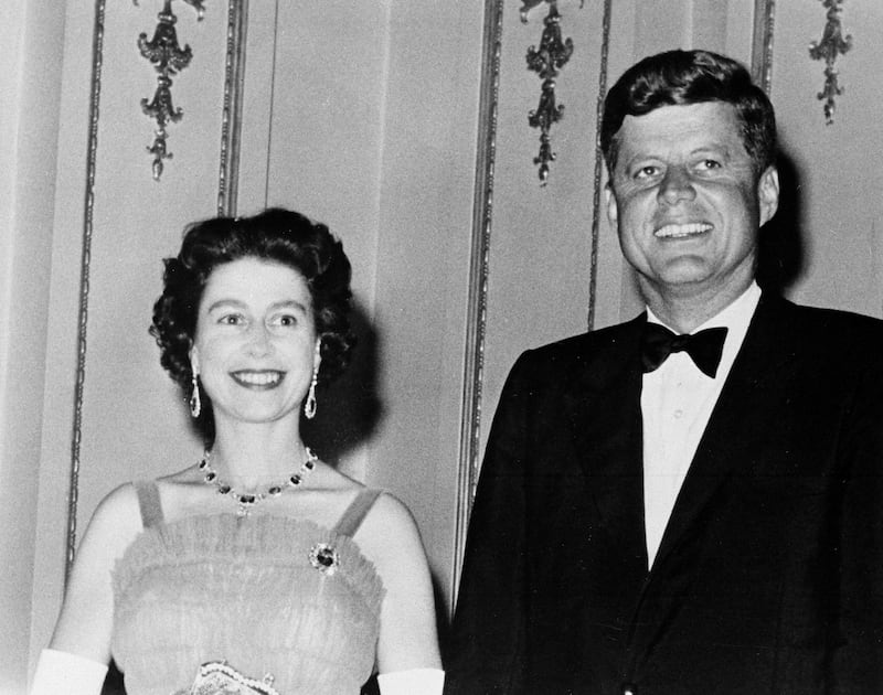 Queen Elizabeth II welcomes former US president John Kennedy to Buckingham Palace. AP