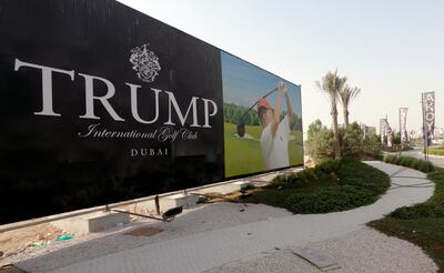 Donald Trump is seen playing golf on a billboard at the Trump International Golf Club in Dubai. AFP