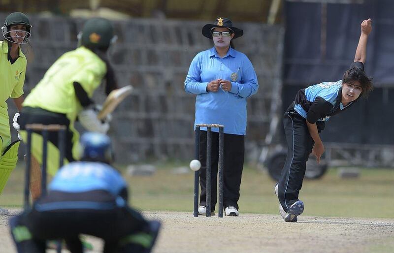 Pakistani national cricket and football player Diana Baig (R), delivers the ball during a domestic cricket championship match in Islamabad in April. Aamir Qureshi / AFP / April 25, 2016