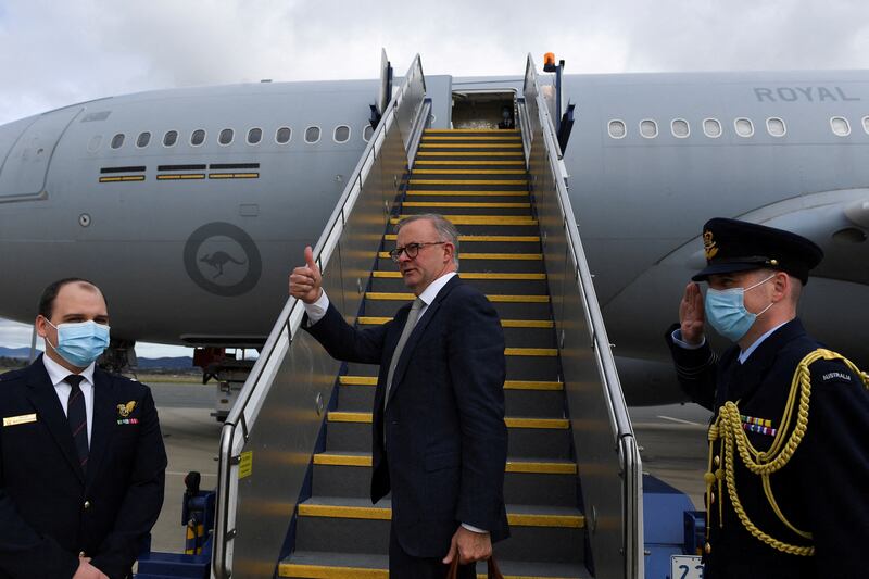 Australian Prime Minister Anthony Albanese boards a plane in Canberra to attend the Quad summit in Tokyo, Japan, after being sworn in on May 23, 2022.  AAP via Reuters