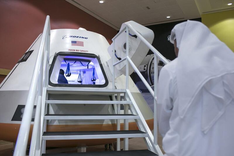 A guest visits the Boeing CST-100 capsule craft that accompanied former US navy pilot and astronaut Capt Chris Ferguson to Mubarak bin Mohammed School in Abu Dhabi. Silvia Razgova / The National