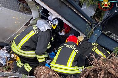 Rescuers at work by the cable car, which crashed to the ground in the resort town of Stresa. AFP 