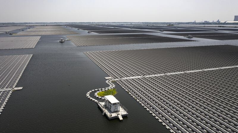 A floating solar farm, built on the site of a former coal mine since filled with water, in Huainan, China. The installation by  Sungrow Power Supply Co covers the size of more than 400 football pitches and generates power for more than 100,000 homes. Getty Images