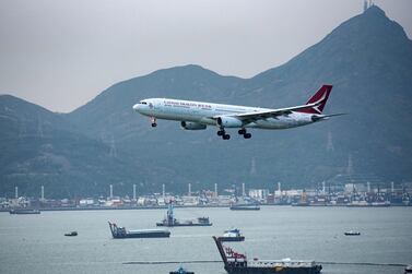 An Airbus A330 jet of Hong Kong carrier Cathay Dragon approaches for landing at Hong Kong Chek Lap Kok International Airport, in Hong Kong. Cathay Pacific, the parent company, will cut over 6000 jobs worldwide and shut the Cathay Dragon brand, as a result of the pandemic's impact on the travel industry. EPA