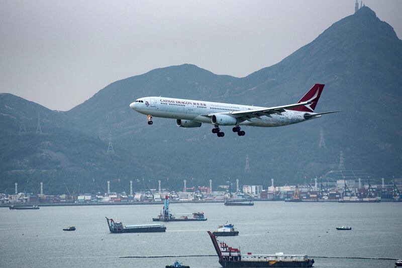 epa08758673 (FILE) - An Airbus A330 airplane of Hong Kong carrier Cathay Dragon approaches for landing at Hong Kong Chek Lap Kok International Airport, in Hong Kong, China, 14 August 2019 (reissued 20 October 2020). The South China Morning Post reports on 20 October 2020 on plans by Cathay Dragon's parent compamny Cathay Pacific to cut some 6,000 jobs worldwide and halt the Cathay Dragon brand.  EPA/MIGUEL CANDELA