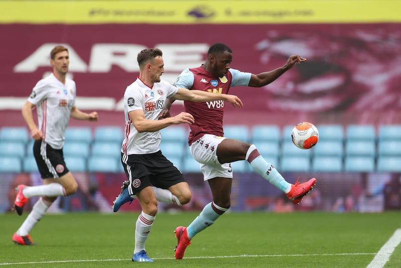 Keinan Davis of Aston Villa is challenged by Jack Robinson of Sheffield United at Villa Park on Wednesday. Getty