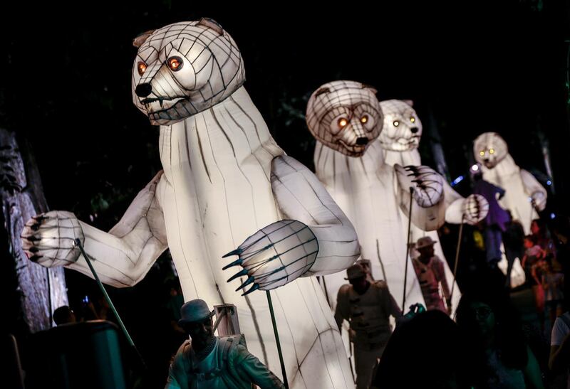 A row of illuminated bear puppets parade during a performance titled 'The Bear's Mouth' by French circus group CIE Remue-Menage, at the Gardens by the Bay in Singapore.  EPA