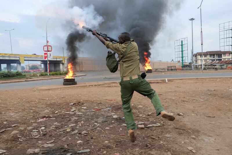 A police officer fires tear gas at protesters in Kisumu. The electoral commission said William Ruto had almost 7.18 million votes (50.49 per cent) against 6.94 million (48.85 per cent) for Raila Odinga, in the August 9 poll. Reuters