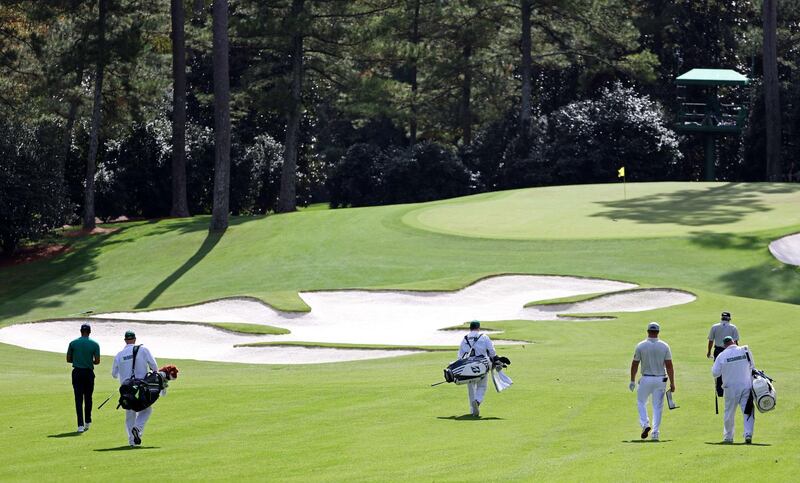 Tiger Woods, Justin Thomas, Bryson DeChambeau and Fred Couples walk during a practice round prior to the Masters. AFP
