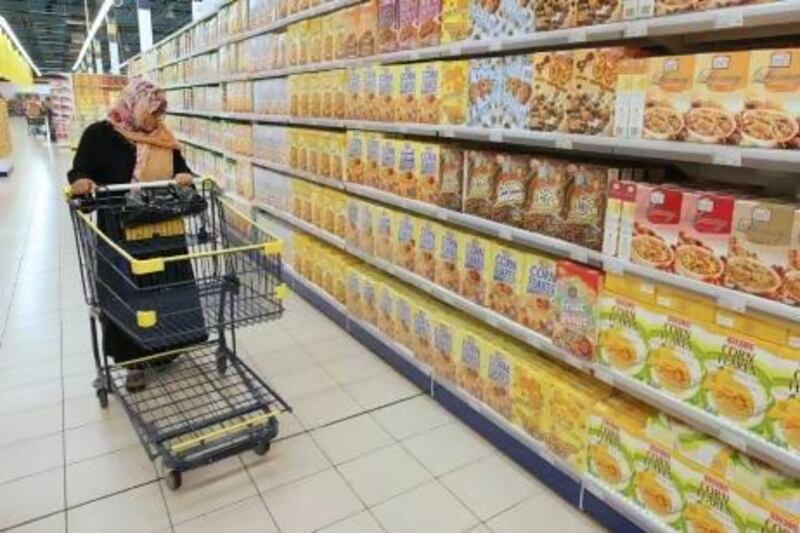 A customer at the Union Cooperate supermarket at Al Barsha Mall, Dubai. Goods for sale will soon have to carry warnings if they contain one of the nine major food allergens. Jaime Puebla / The National