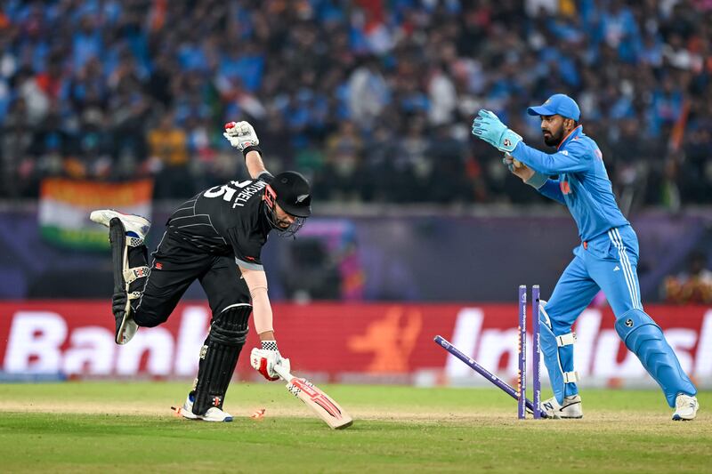 India's KL Rahul tries to run out New Zealand's Daryl Mitchell.  AFP