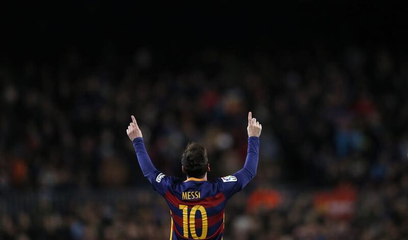 Barcelona’s Lionel Messi, left, reacts after scoring against Espanyol during a Copa del Rey soccer match at the Camp Nou stadium in Barcelona, Spain, Wednesday, Jan. 6, 2016. (AP Photo/Manu Fernandez)