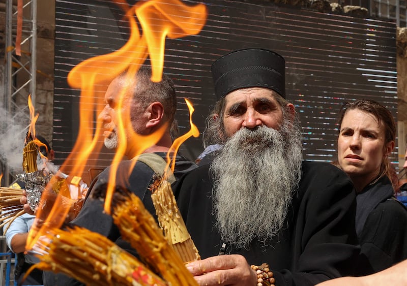 An Orthodox priest in the courtyard of Jerusalem's Holy Sepulchre church during the Holy Fire ceremony. AFP
