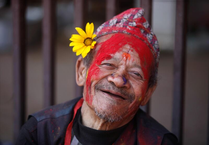 A man with coloured powder smeared on his face is pictured while celebrating Holi, the festival of colours, in Kathmandu, Nepal, March 9, 2020. Reuters