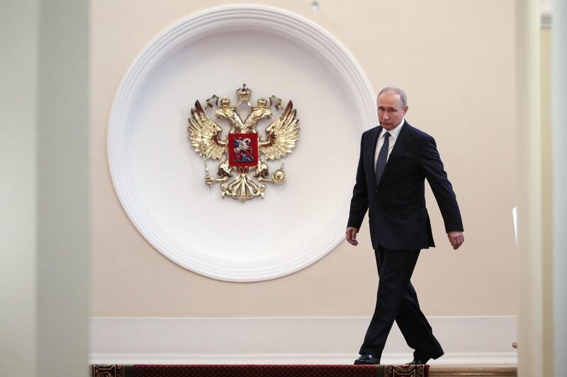 Vladimir Putin walks prior to his inauguration ceremony at the Kremlin in Moscow. Sergei Bobylyov / AFP