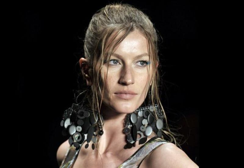 Brazilian supermodel Gisele Bundchen presents an outfit by Colcci during the 2010-2011 Spring-Summer collection of the Sao Paulo Fashion Week, in Sao Paulo, Brazil, on June 13, 2010. AFP PHOTO/Mauricio LIMA