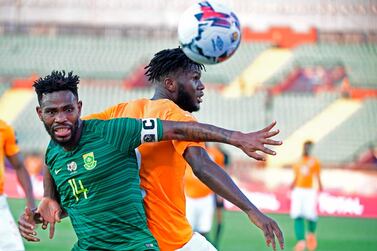 South Africa defender Thulani Hlatshwayo, left, fights for the ball with Ivory Coast midfielder Franck Kessie. AFP