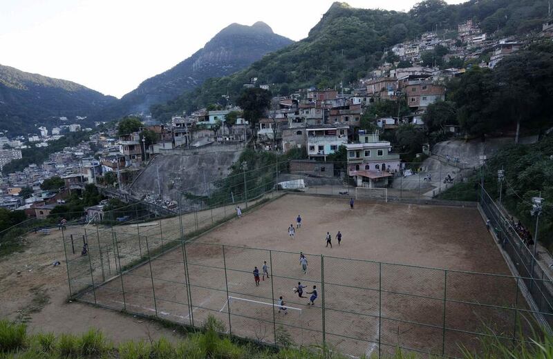 A view of a Sunday "pelada" football match in the Borel favela of Rio de Janeiro, a World Cup host city, on May 4, 2014. Sunday football is a decades-old tradition when Brazilians of all walks of life play on the beaches, in the slums, and on the streets in matches that are known as "peladas" or "naked". Ricardo Moraes / Reuters