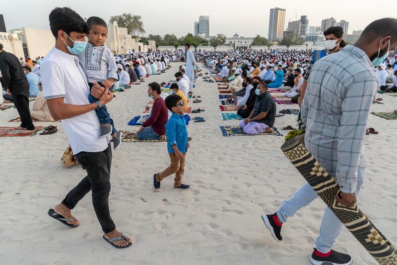 People assemble for the Eid Al Adha morning prayers at the Bur Dubai Eid Musallah (prayer) ground on July 20