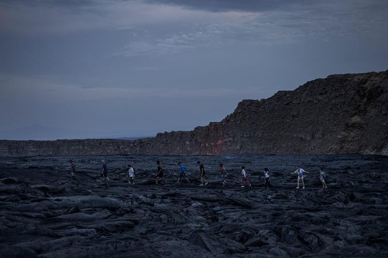 Tourists at the volcano's lava fields