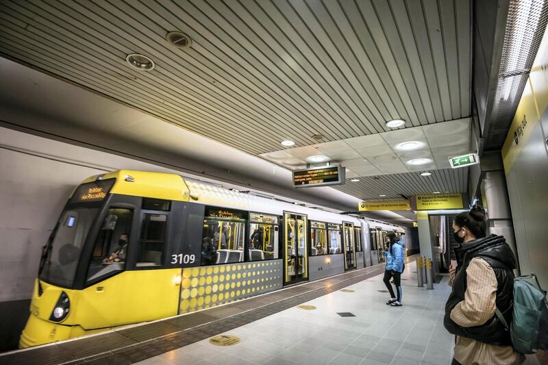Feature on Manchester City FC at the Etihad complex and Manchester city centre.
PIC shows Metrolink tram journey - Piccadilly station.