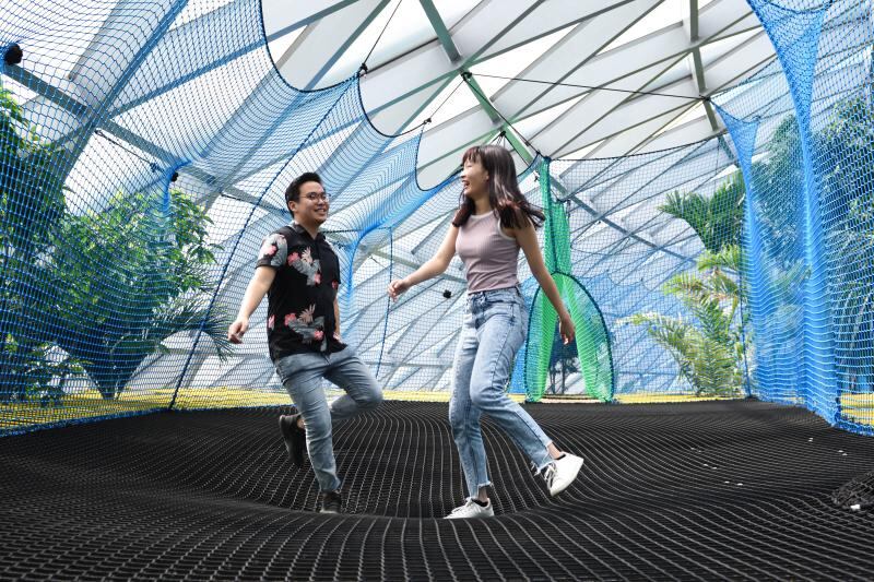 Travellers enjoy bouncing on nets at Changi Airport. Photo: Changi Airport Group