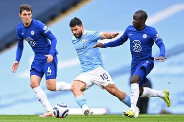 TOPSHOT - Manchester City's Argentinian striker Sergio Aguero (C) vies with Chelsea's Danish defender Andreas Christensen (L) and Chelsea's French midfielder N'Golo Kante (R) during the English Premier League football match between Manchester City and Chelsea at the Etihad Stadium in Manchester, north west England, on May 8, 2021. RESTRICTED TO EDITORIAL USE. No use with unauthorized audio, video, data, fixture lists, club/league logos or 'live' services. Online in-match use limited to 120 images. An additional 40 images may be used in extra time. No video emulation. Social media in-match use limited to 120 images. An additional 40 images may be used in extra time. No use in betting publications, games or single club/league/player publications. / AFP / POOL / Laurence Griffiths / RESTRICTED TO EDITORIAL USE. No use with unauthorized audio, video, data, fixture lists, club/league logos or 'live' services. Online in-match use limited to 120 images. An additional 40 images may be used in extra time. No video emulation. Social media in-match use limited to 120 images. An additional 40 images may be used in extra time. No use in betting publications, games or single club/league/player publications.