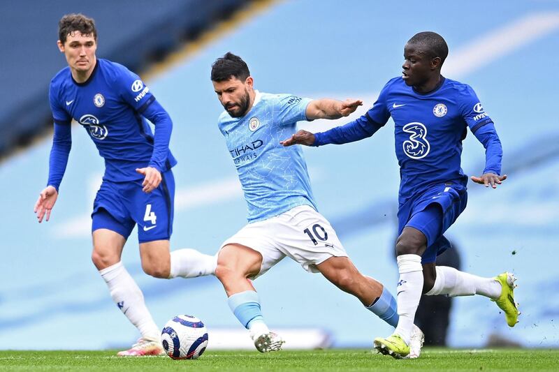 TOPSHOT - Manchester City's Argentinian striker Sergio Aguero (C) vies with Chelsea's Danish defender Andreas Christensen (L) and Chelsea's French midfielder N'Golo Kante (R) during the English Premier League football match between Manchester City and Chelsea at the Etihad Stadium in Manchester, north west England, on May 8, 2021. RESTRICTED TO EDITORIAL USE. No use with unauthorized audio, video, data, fixture lists, club/league logos or 'live' services. Online in-match use limited to 120 images. An additional 40 images may be used in extra time. No video emulation. Social media in-match use limited to 120 images. An additional 40 images may be used in extra time. No use in betting publications, games or single club/league/player publications.
 / AFP / POOL / Laurence Griffiths / RESTRICTED TO EDITORIAL USE. No use with unauthorized audio, video, data, fixture lists, club/league logos or 'live' services. Online in-match use limited to 120 images. An additional 40 images may be used in extra time. No video emulation. Social media in-match use limited to 120 images. An additional 40 images may be used in extra time. No use in betting publications, games or single club/league/player publications.
