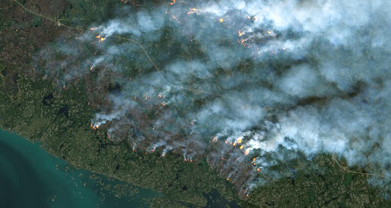 A satellite image shows wildfires burning in Yellowknife, Northwest Territories, Canada. AFP