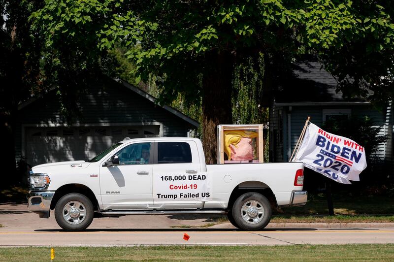 A Joe Biden supporter drives his truck near a President Donald Trump event in Oshkosh, Wisconsin. AFP