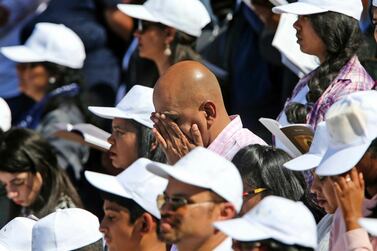 Worshippers pray during the first ever papal Mass in the Gulf at the Zayed Sports City in Abu Dhabi. AP