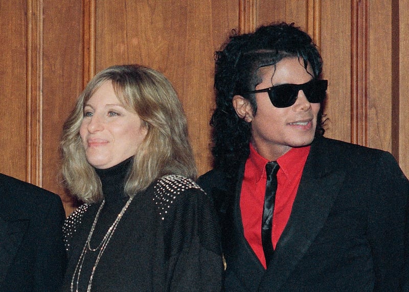 FILE - In this Dec. 14, 1986, file photo, singers Barbra Streisand and Michael Jackson attend the Scopus Awards of the American Friends of the Hebrew University ceremony in Los Angeles. Streisand is apologizing outright for her comments about sexual abuse allegations against Michael Jackson. She said in a second statement Saturday, March 23, 2019, that she should have chosen her words more carefully, and admires the accusers for "speaking their truth." (AP Photo/Mark Avery, File)