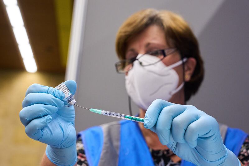 An employee of the GGD Haaglanden prepares equipment to dispense the monkeypox vaccination at a vaccination location in Rijswijk, in the Netherlands. EPA