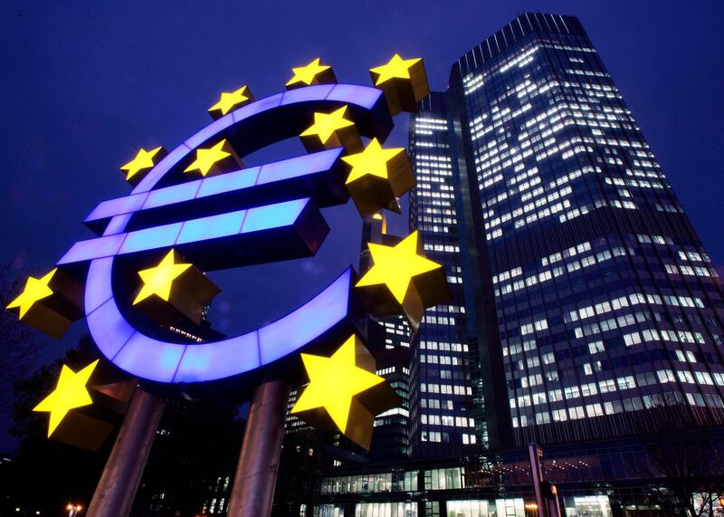 FILE - In this Nov. 30, 2005 file photo a giant Euro symbol stands in front of the European Central Bank (ECB) in Frankfurt, Germany. The euro turns 20 at year end but its member countries are still wrestling over exactly how the shared currency should work and how to fix flaws mercilessly exposed by a debt crisis that scarred the currencyâ€™s second decade. (AP Photo/Michael Probst, file)