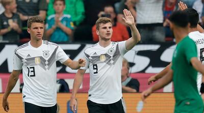 epa06794636 Germany's Timo Werner (C) celebrates scoring the 1-0 lead with teammates Thomas Mueller (L) and Jonas Hector (R) during the international friendly soccer match between Germany and Saudi Arabia in Leverkusen, Germany, 08 June 2018.  EPA/RONALD WITTEK