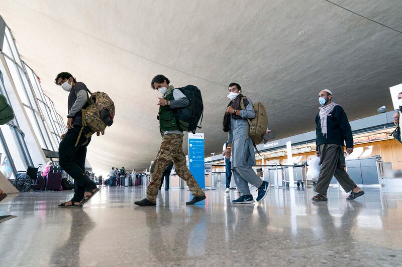 People who fled the Taliban in Afghanistan arrive at Washington Dulles International Airport in the US. AP