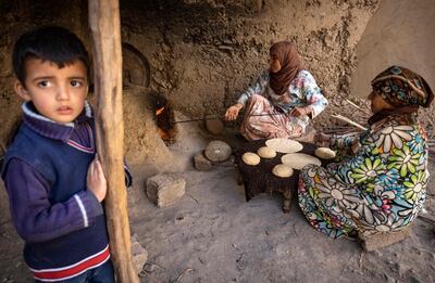 Moroccan women preparing bread in a village in the Atlas mountains. AFP