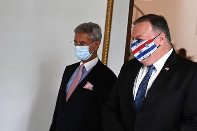 U.S. Secretary of State Mike Pompeo, right, and Indian Foreign Minister Subrahmanyam Jaishankar arrive to attend their meeting in Tokyo, Tuesday, Oct. 6, 2020, ahead of the four Indo-Pacific nations' foreign ministers meeting. (Charly Triballeau/Pool Photo via AP)