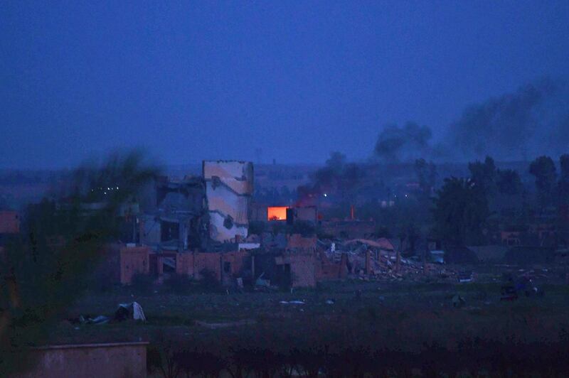 Smoke rising over the village of Baghouz in the eastern Syrian province of Deir Ezzor.  AFP