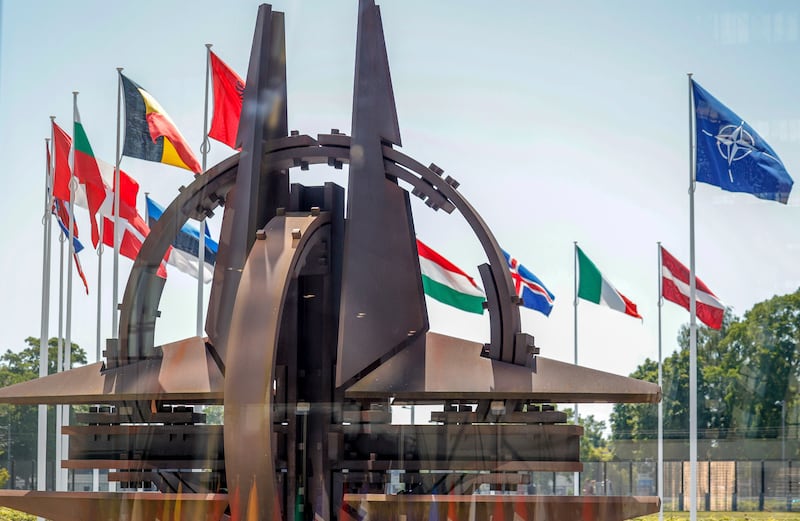 Flags of Nato member countries flap in the wind outside the alliance headquarters in Brussels last week. AP Photo