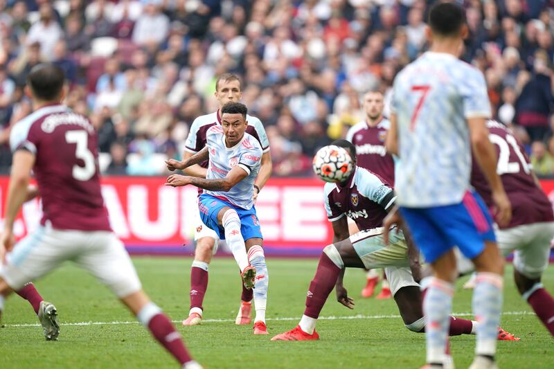 Jesse Lingard shoots to score Manchester United's second goal against West Ham. PA