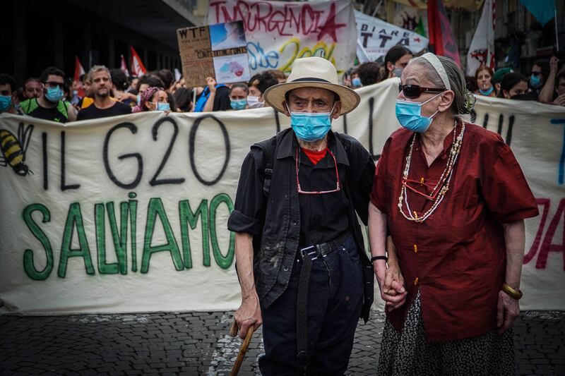 Demonstrators wear facemasks during the protest in Naples.