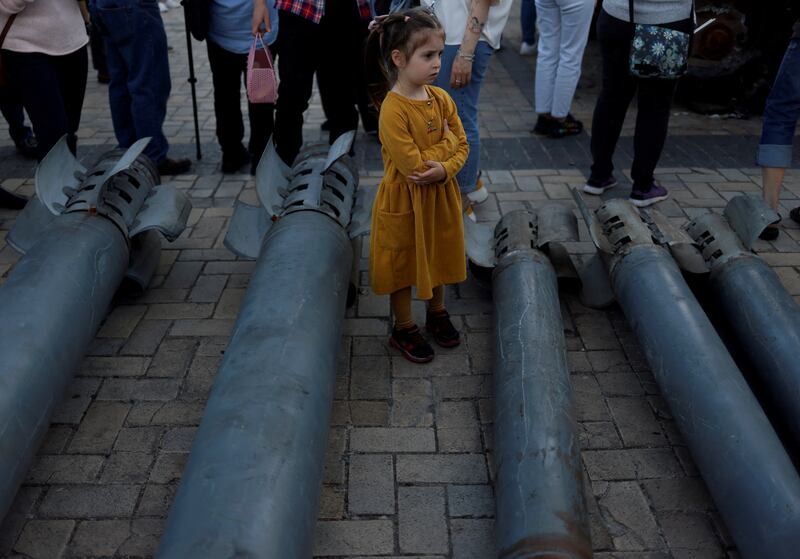 A girl in Kyiv looks at Russian weapons used in the attack on Ukraine. Reuters